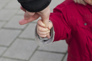 Child holding onto parent