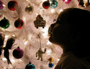 Child in front of Christmas tree